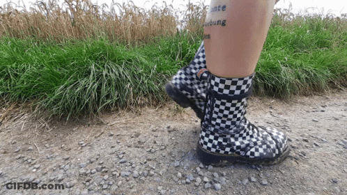Person In Black-And-White Checkered Boots With Peace Tattoo GIF