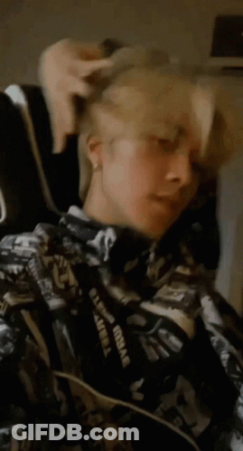 Person In Black And White Jacket With Supreme Lanyard GIF