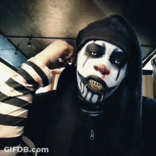 Person In Black And White Striped Shirt And Clown Makeup GIF