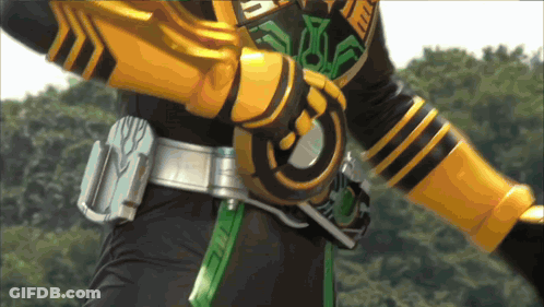 Person In Black And Yellow Costume With Circle Belt GIF