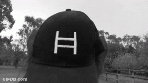 Person In Black Baseball Cap With Letter H GIF