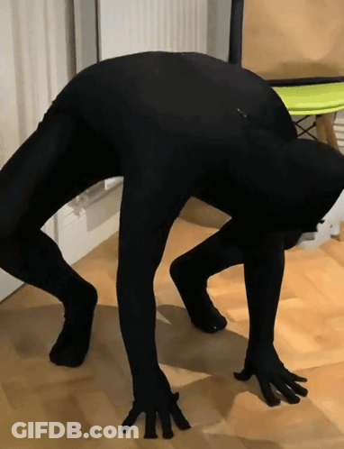 Person In Black Bodysuit Bending Over GIF