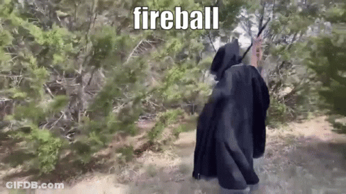 Person In Black Cloak Walking Forest Fireball GIF