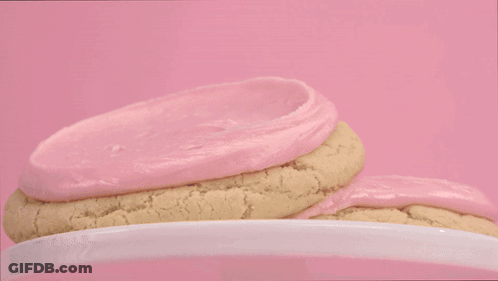 Person In Black Gloves Frosting Cookie GIF