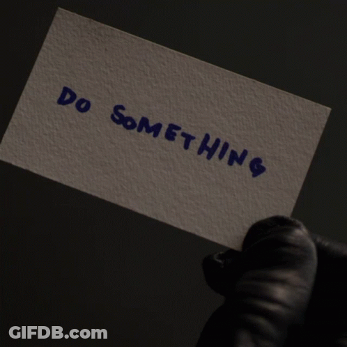 Person In Black Gloves Holding No Swifting Sign GIF