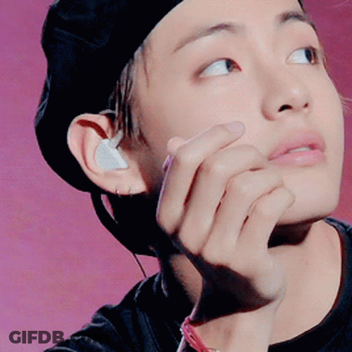 Person In Black Hat With Earbuds GIF