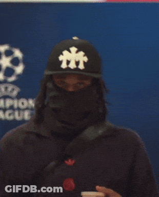 Person In Black Hat With Letter T GIF