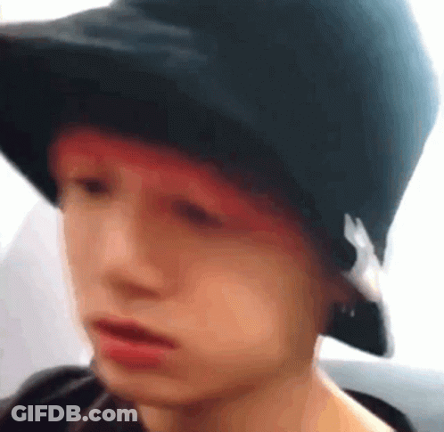 Person In Black Hat With Red Hair GIF