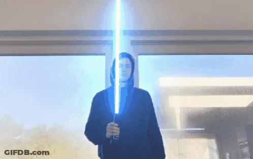 Person In Black Hoodie Holding Blue Lightsaber GIF