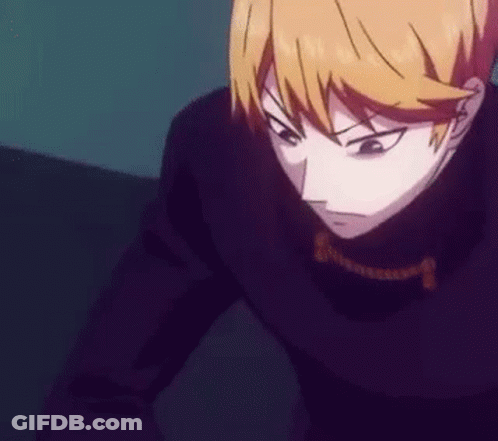 Person In Black Jacket And Necklace In Dark Room GIF