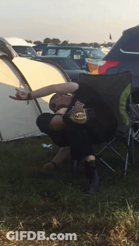 Person In Black Leaf Shirt On Folding Chair GIF