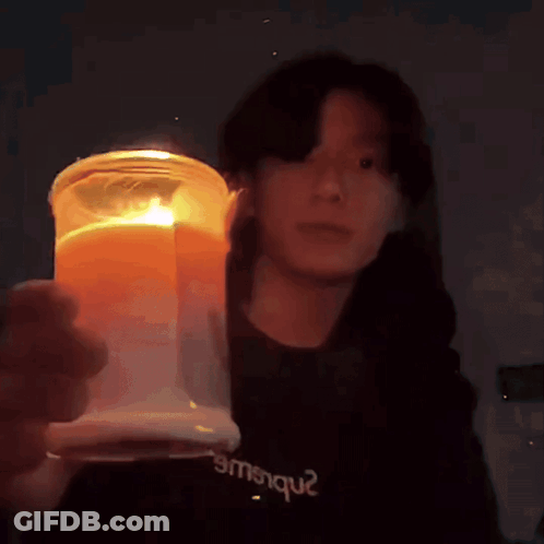 Person In Black Shirt Emsique Holding Candle GIF