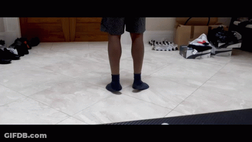Person In Black Socks Standing GIF