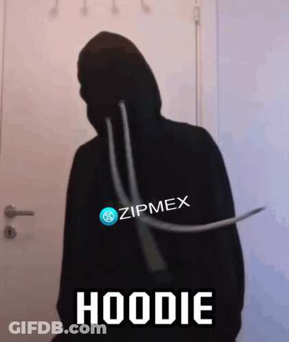 Person In Black Zipmex Hoodie Standing In Front Of Door GIF