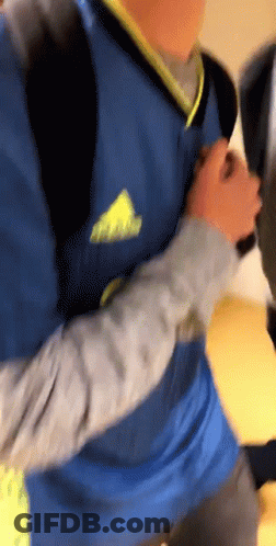 Person In Blue Adidas Shirt Holding Hand GIF