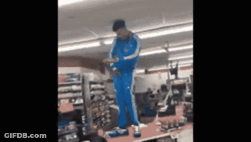 Person In Blue Adidas Tracksuit On Shoe Display GIF