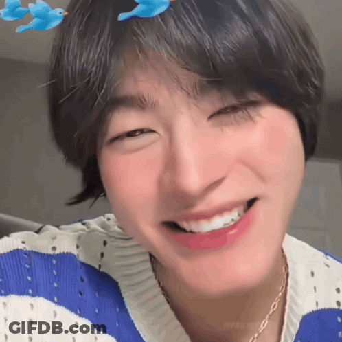 Person In Blue And White Striped Sweater And Necklace GIF