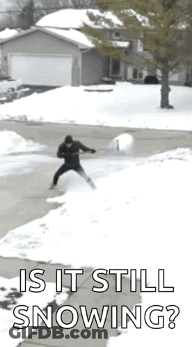 Person In Blue Coat Walking Through Snow GIF