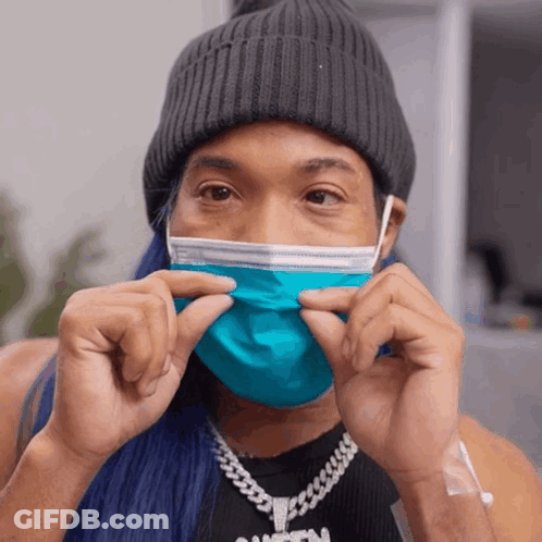 Person In Blue Face Mask And Black Tank Top GIF