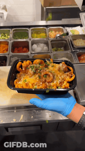 Person In Blue Gloves Holding Black Food Container GIF