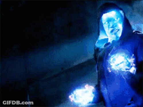 Person In Blue Hoodie Surrounded By Glowing Lights GIF