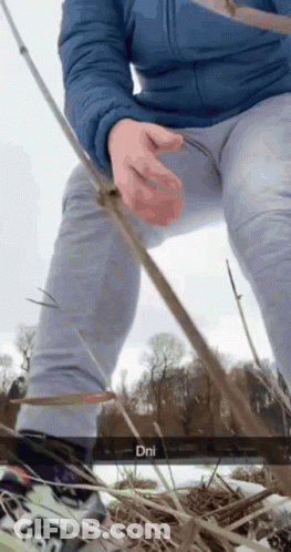 Person In Blue Jacket And Grey Pants Holding Fishing Rod DNI GIF