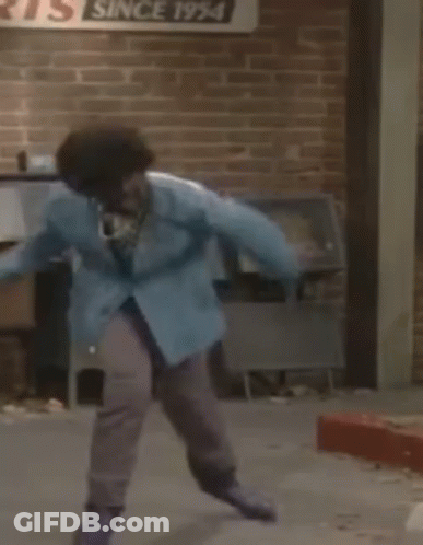 Person In Blue Jacket Jumping Near Mailbox GIF