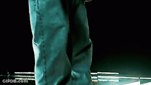 Person In Blue Jeans On Dark Surface GIF