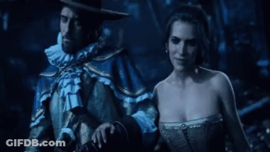 Person In Blue Suit Holding Gun In Dark Room GIF