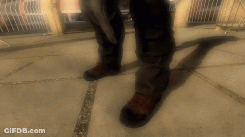 Person In Brown Shoes On Concrete Floor GIF