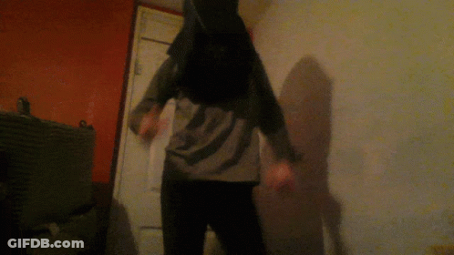 Person In Bunny Costume Standing In Dark Room GIF