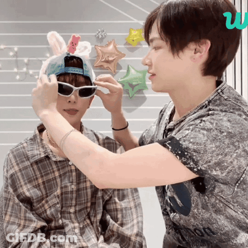 Person In Bunny Hat And Sunglasses Being Helped GIF