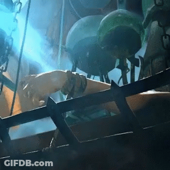 Person In Cage With Blue Light On Arm GIF