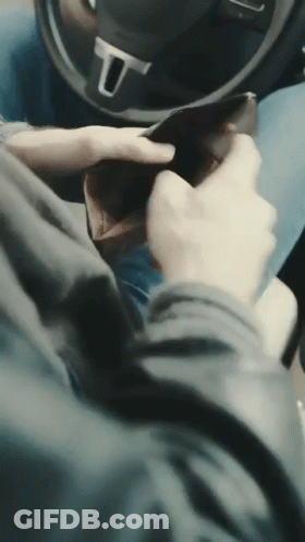 Person In Car With Steering Wheel Letter U GIF