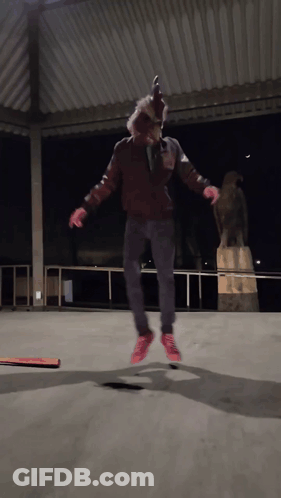 Person In Chicken Mask Jumping GIF