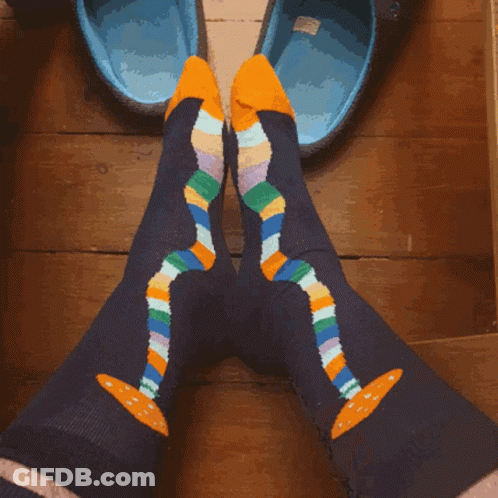 Person In Colorful Socks With Yellow Soles GIF