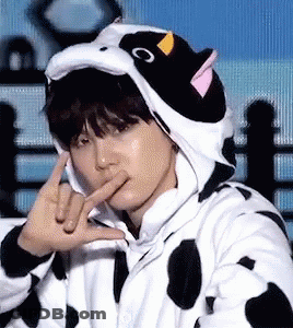 Person In Cow Costume Making Peace Sign GIF
