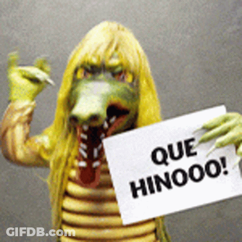 Person In Crocodile Costume Holding Sign Que Hinooo GIF