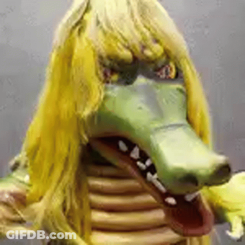 Person In Crocodile Mask With Yellow Hair GIF