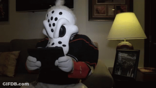 Person In Dalmatian Mask Using Tablet GIF