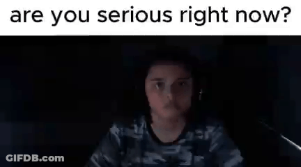 Person In Dark Room Looking At Computer Screen GIF