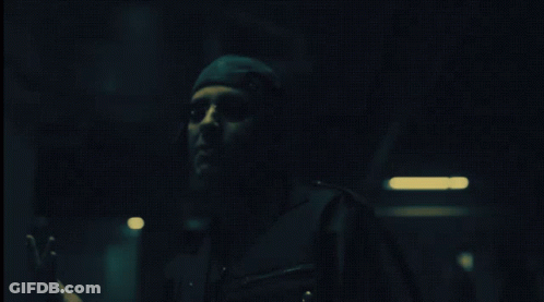 Person In Dark Room With Hand Out GIF