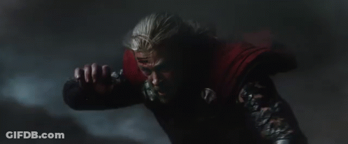 Person In Dark Room With Red Chest Light GIF