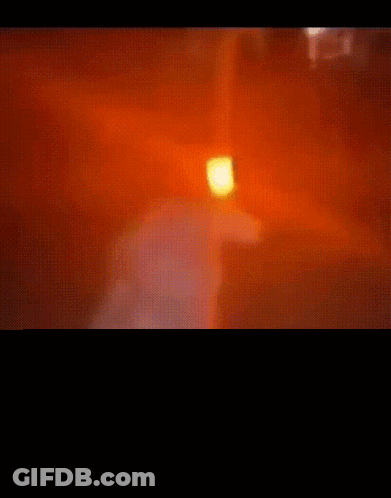Person In Dark Room With Red Light GIF