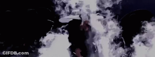 Person In Dark Room With Smoke From Ceiling GIF