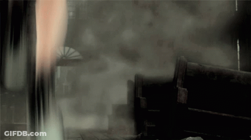 Person In Dark Room With Smoke From Window GIF