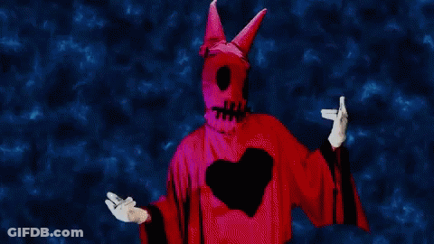 Person In Devil Costume With Heart GIF