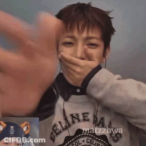 Person In Feline Sweater Covering Mouth GIF