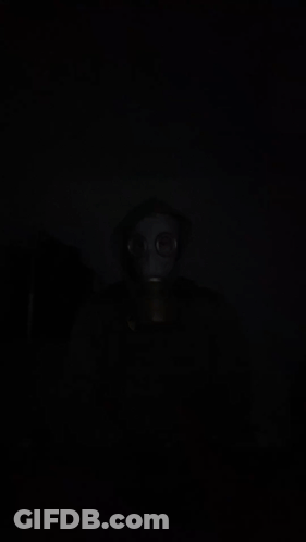 Person In Gas Mask And Hood GIF