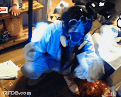 Person In Gas Mask Kneeling In Front Of Sign Saying T GIF